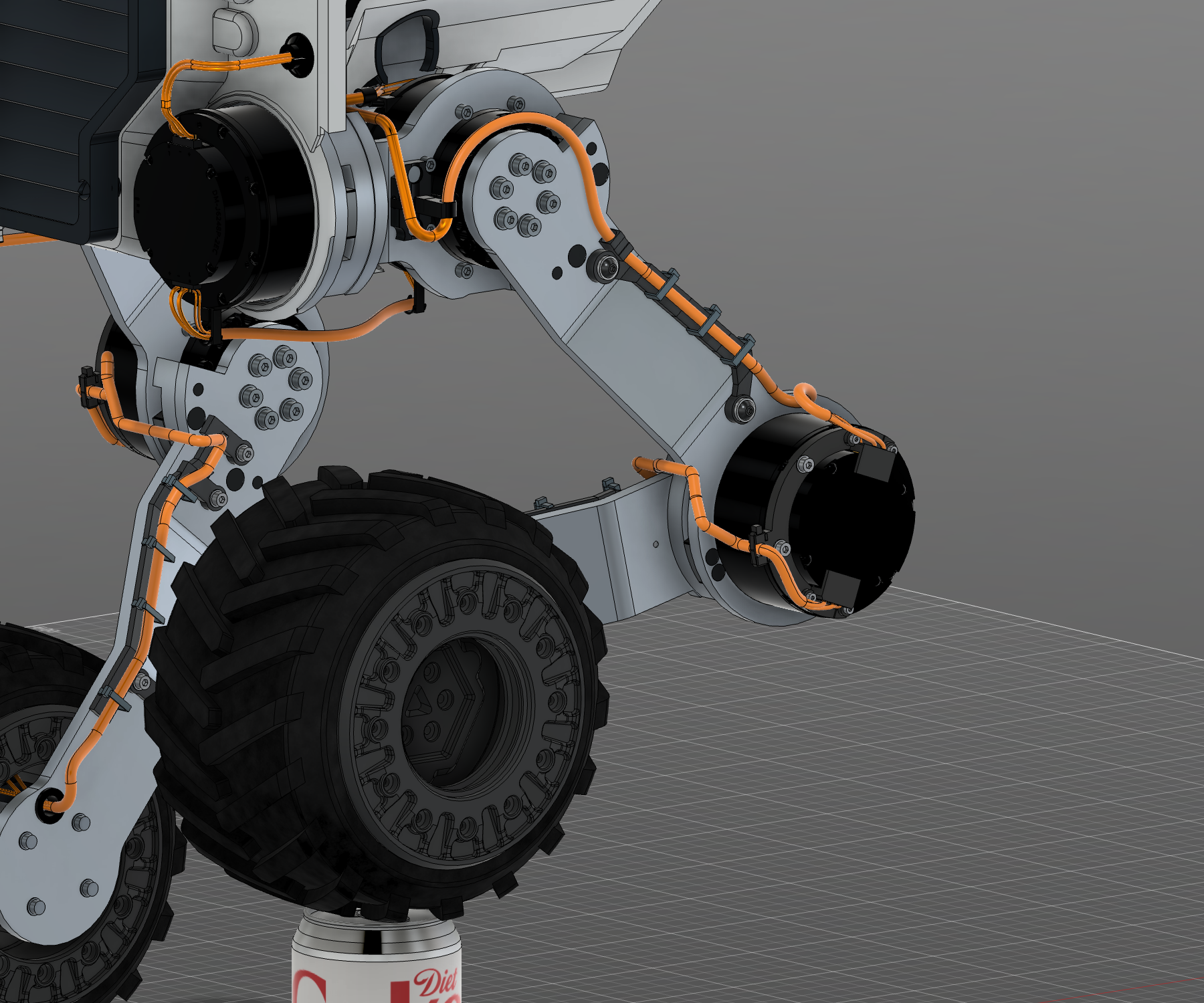 R11 assembled leg showing orange harness laid into matching open guards with local zip ties and compact knee plug covers.