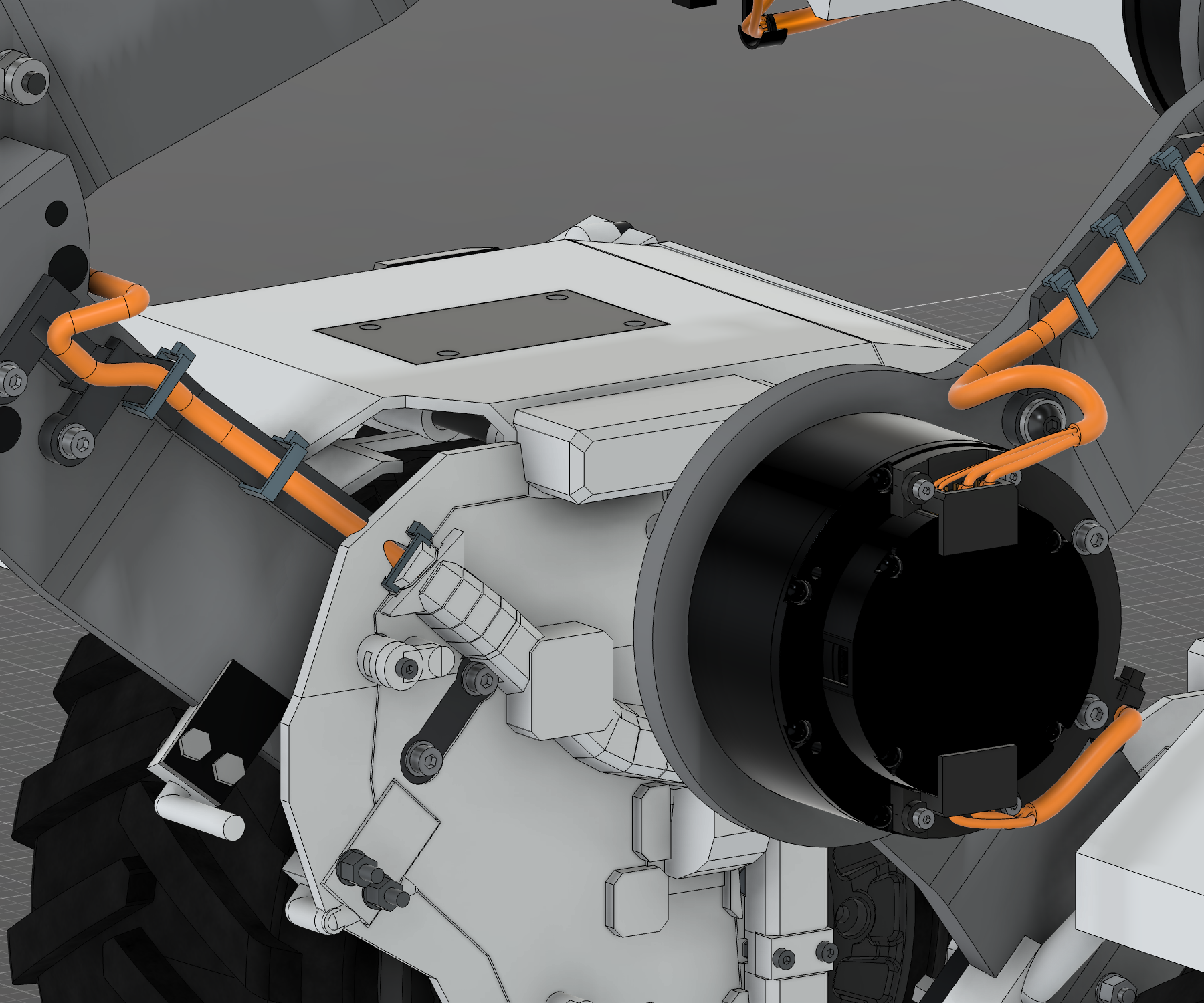 R12 · Protected tibia cable passage — The local four-core path passes through the modified tibia and matching rear adapter into the covered fender. Thread the cable before controller-end termination; abrasion and electrical behavior need physical qualification.